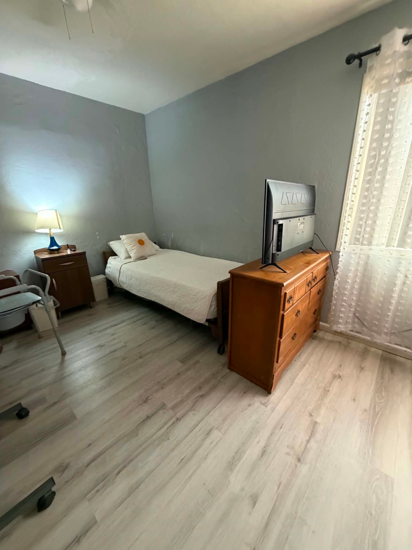 Private resident bedroom with adjustable bed and TV